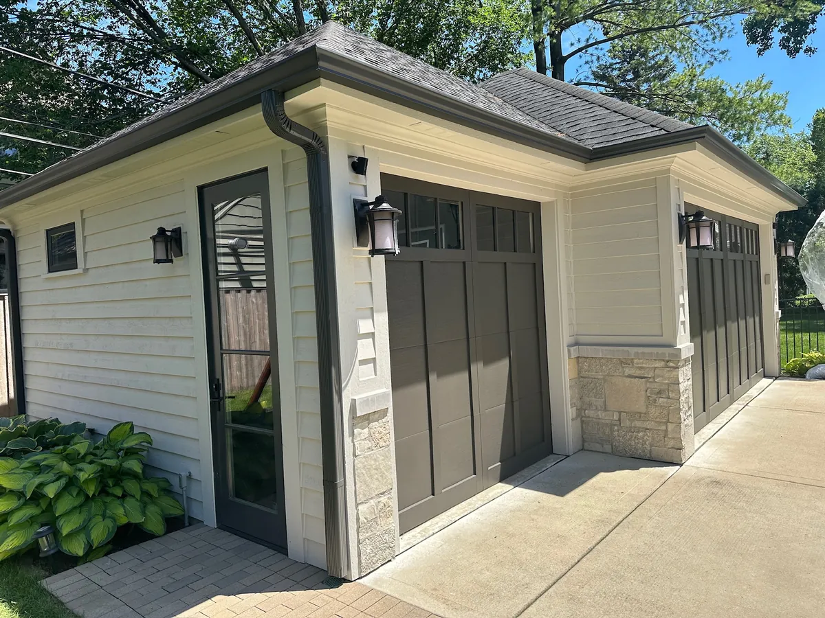 Brick garage with new seamless gutters and downspout