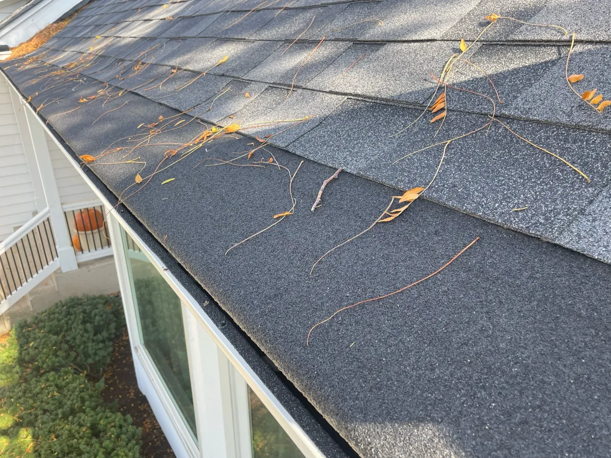 Carriage-style garage with dark seamless gutters